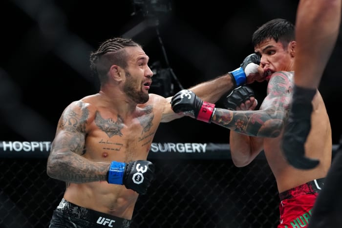 Daniel Zellhuber (red gloves) fights Christos Giagos (blue gloves) during UFC Fight Night at T-Mobile Arena.